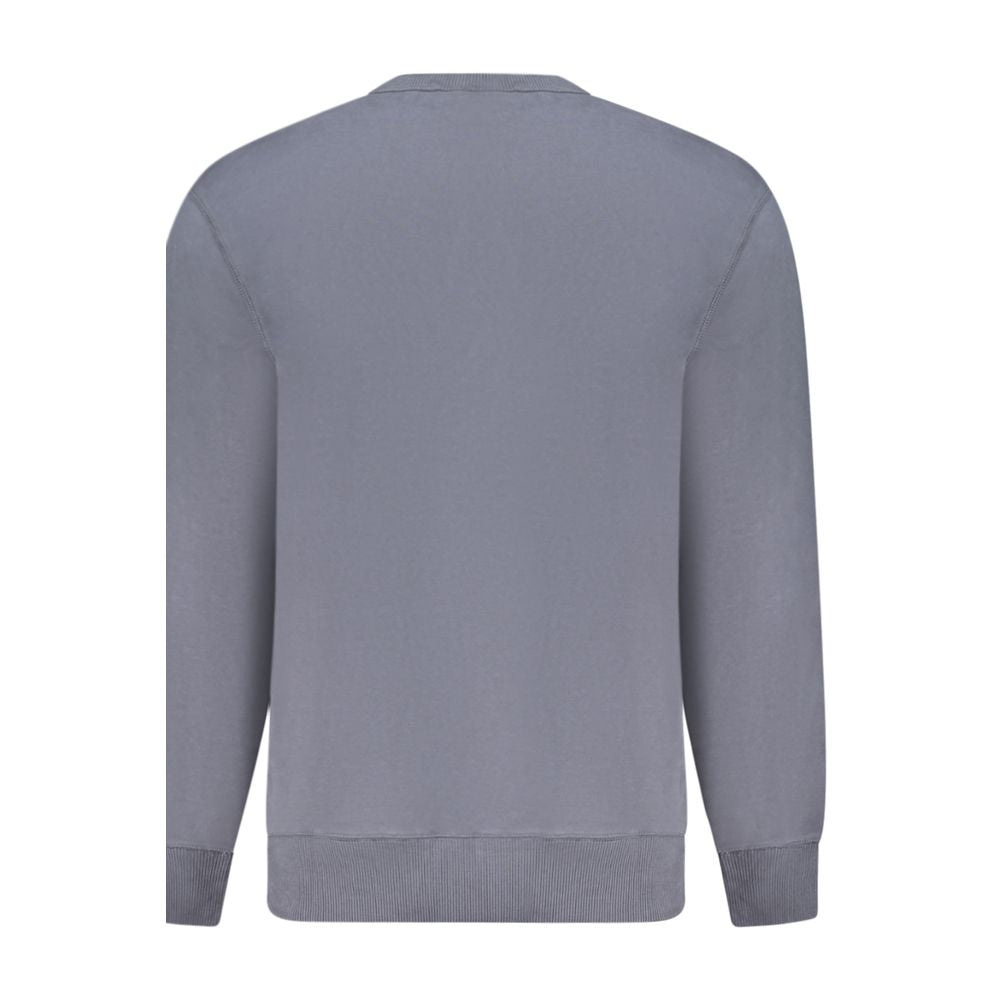 Pull homme Calvin Klein en coton bleu, coupe classique, avec logo discret sur la poitrine, porté de face.