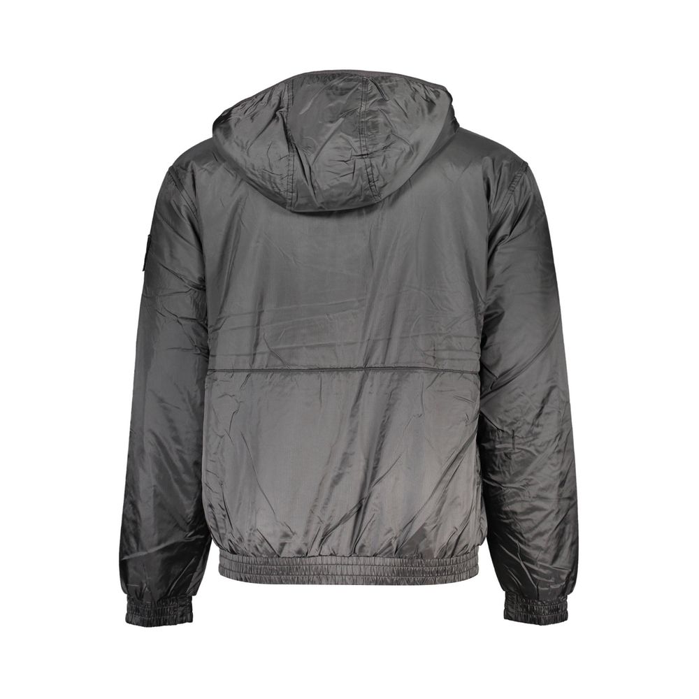 Veste pour homme en polyester noir de la marque Calvin Klein, style décontracté avec fermeture éclair et col montant.