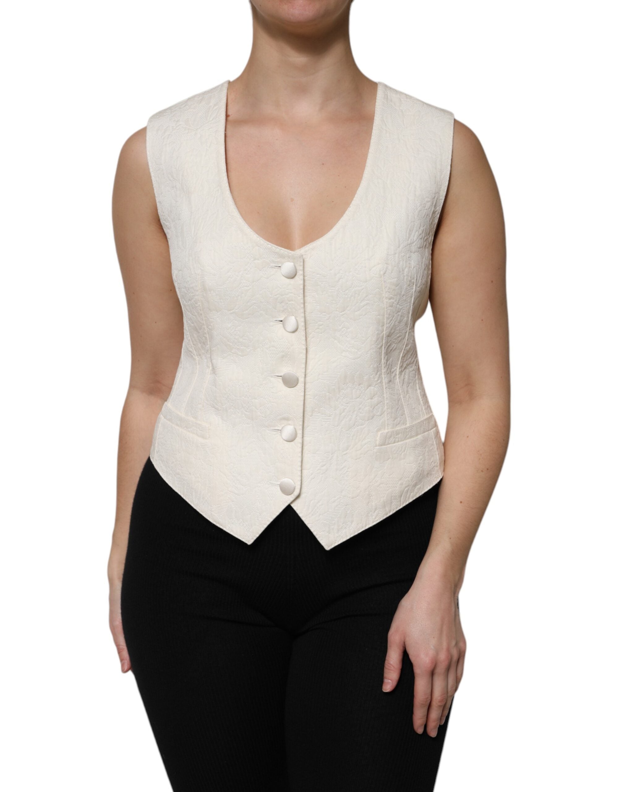 Veste sans manches en coton ivoire Dolce & Gabbana avec boutons, élégante et légère, vue de face sur fond neutre.