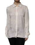 Chemise blanche Dolce & Gabbana à manches longues avec boutons, vue de face, élégante et sophistiquée.