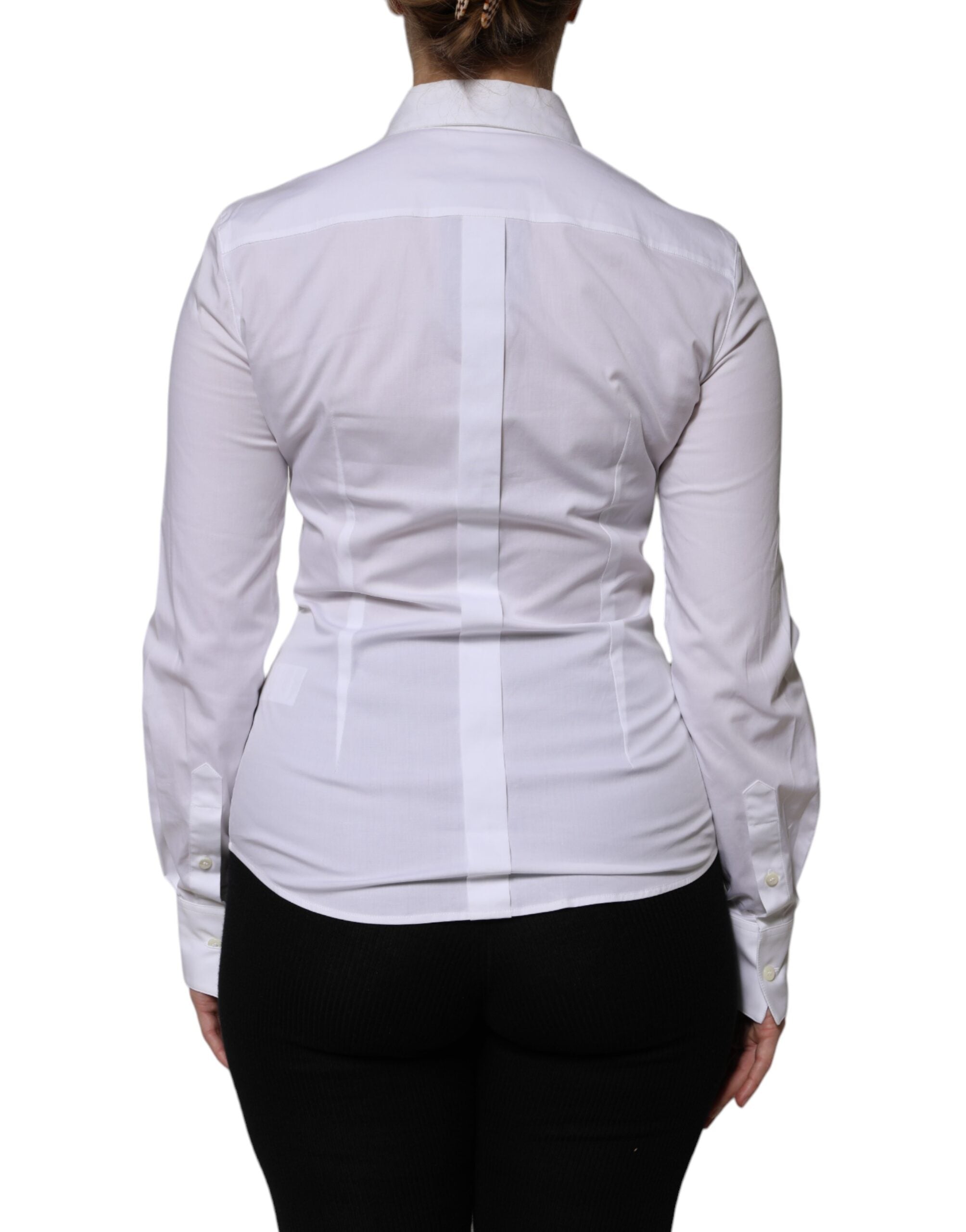 Chemisier blanc en coton à col et manches longues de Dolce & Gabbana, élégant et classique, visible sur l'image.