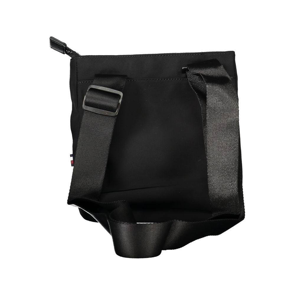 Sac à bandoulière pour homme Tommy Hilfiger en polyester noir, avec poches et logo emblématique visible.