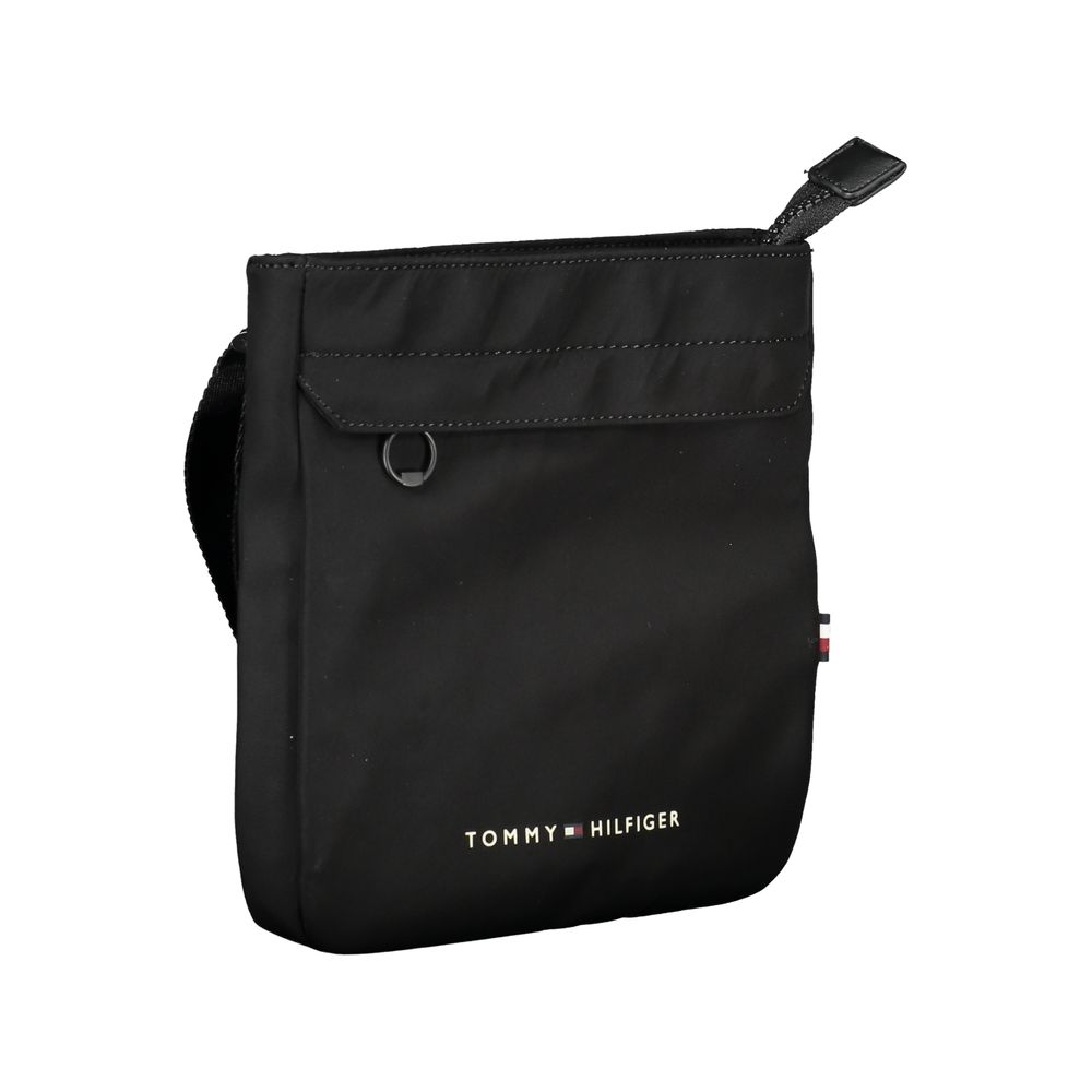 Sacoche homme Tommy Hilfiger en polyester noir, sac d'épaule élégant avec compartiments pratiques et logo visible.