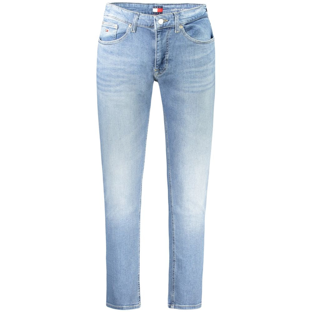 Jean slim tapered en coton bleu azur de Tommy Hilfiger pour homme, coupe moderne et élégante, détail clair visible sur la photo.