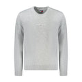 Pull en polyester gris pour homme de la marque Tommy Hilfiger, avec col rond et logo discret sur la poitrine.