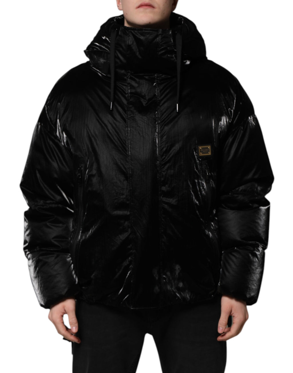 Veste matelassée noire Dolce & Gabbana à capuche avec logo, fermeture éclair intégrale, design élégant et moderne.