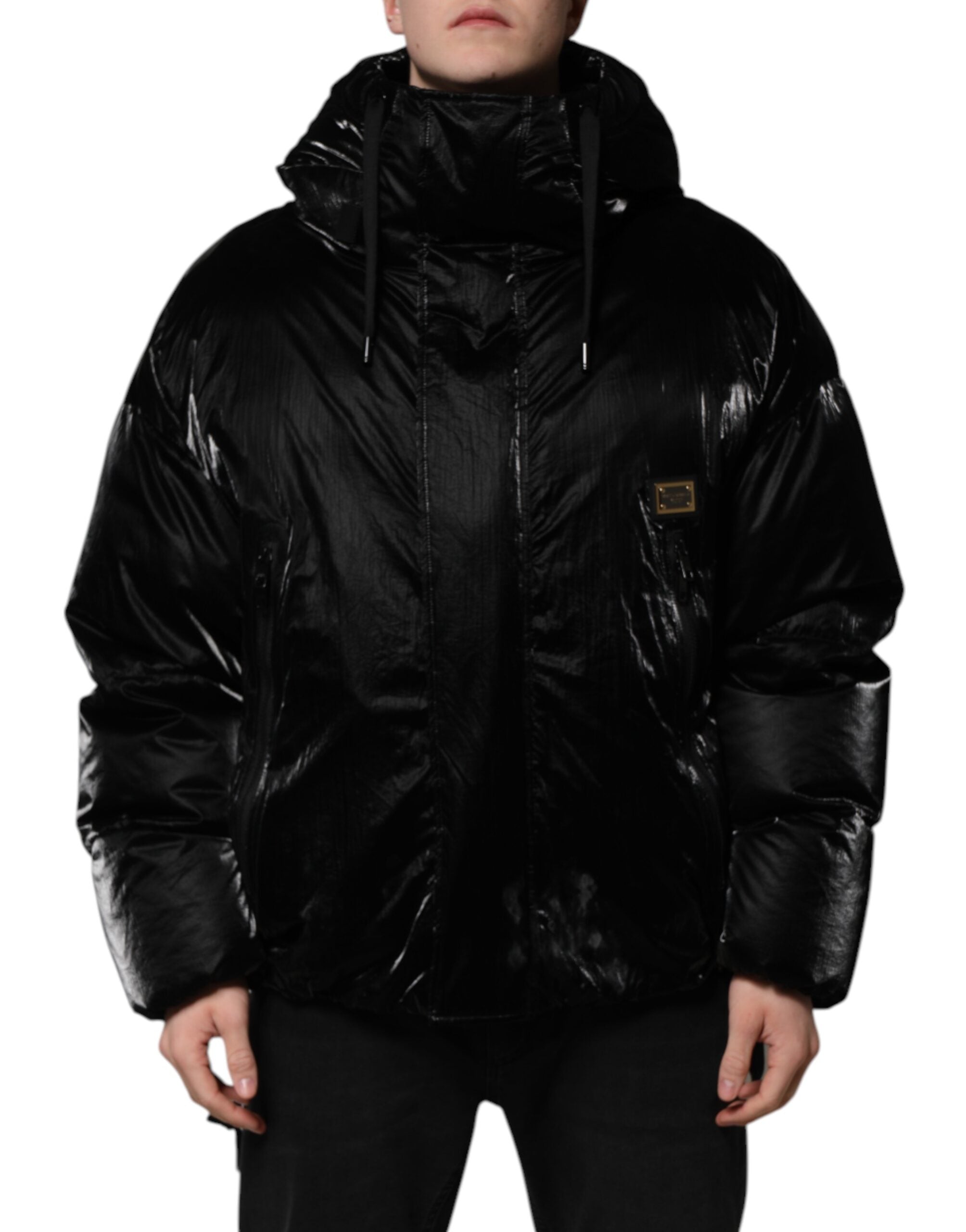 Veste matelassée noire Dolce & Gabbana à capuche avec logo, fermeture éclair intégrale, design élégant et moderne.
