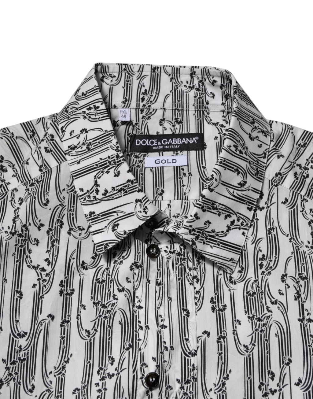 Chemise blanche Dolce & Gabbana à manches longues avec imprimé floral décontracté, tissu léger et élégant.