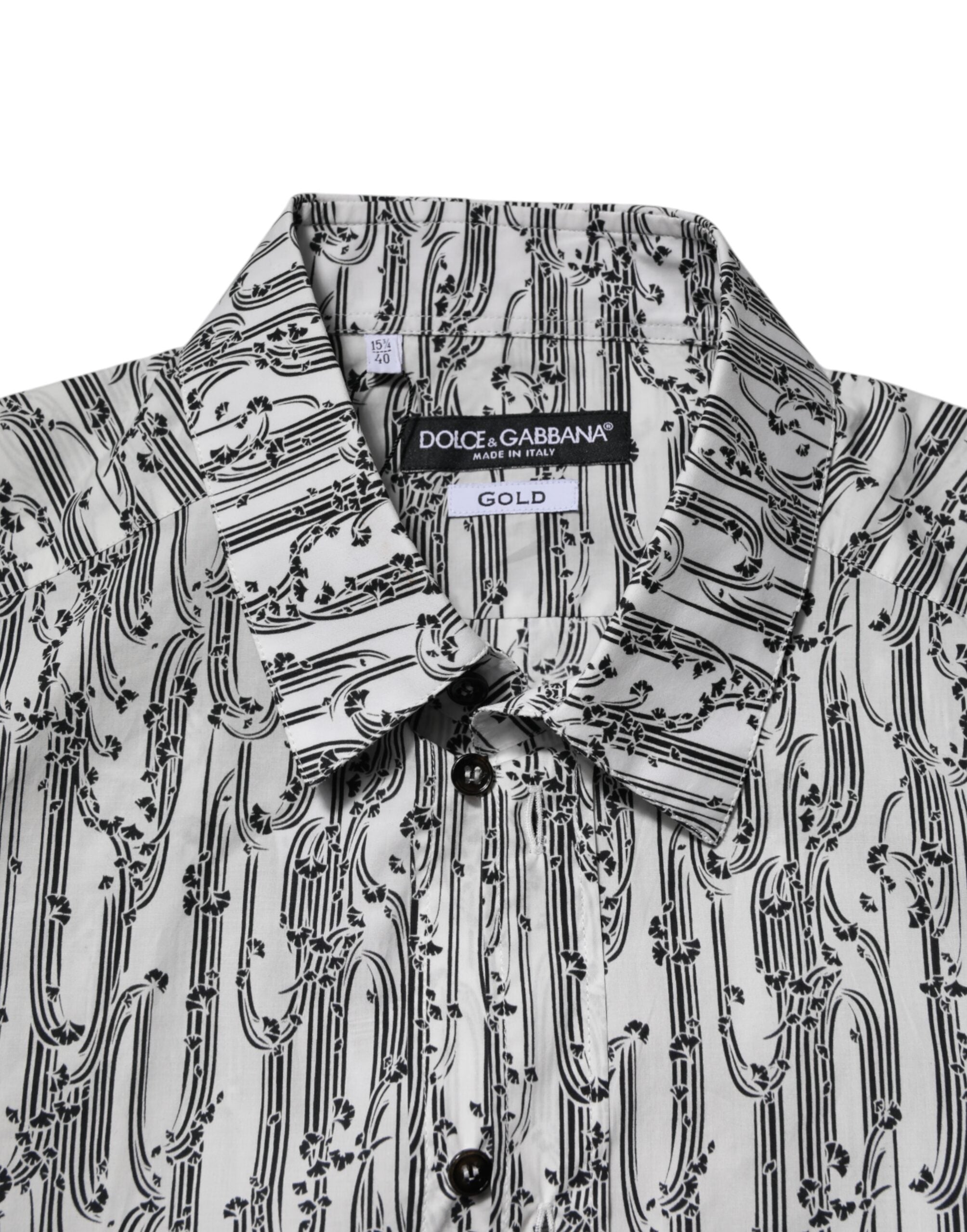 Chemise blanche Dolce & Gabbana à manches longues avec imprimé floral décontracté, tissu léger et élégant.