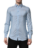 Chemise longue Dolce & Gabbana Martini à rayures bleues avec manches longues, élégante et sophistiquée, vue de face.