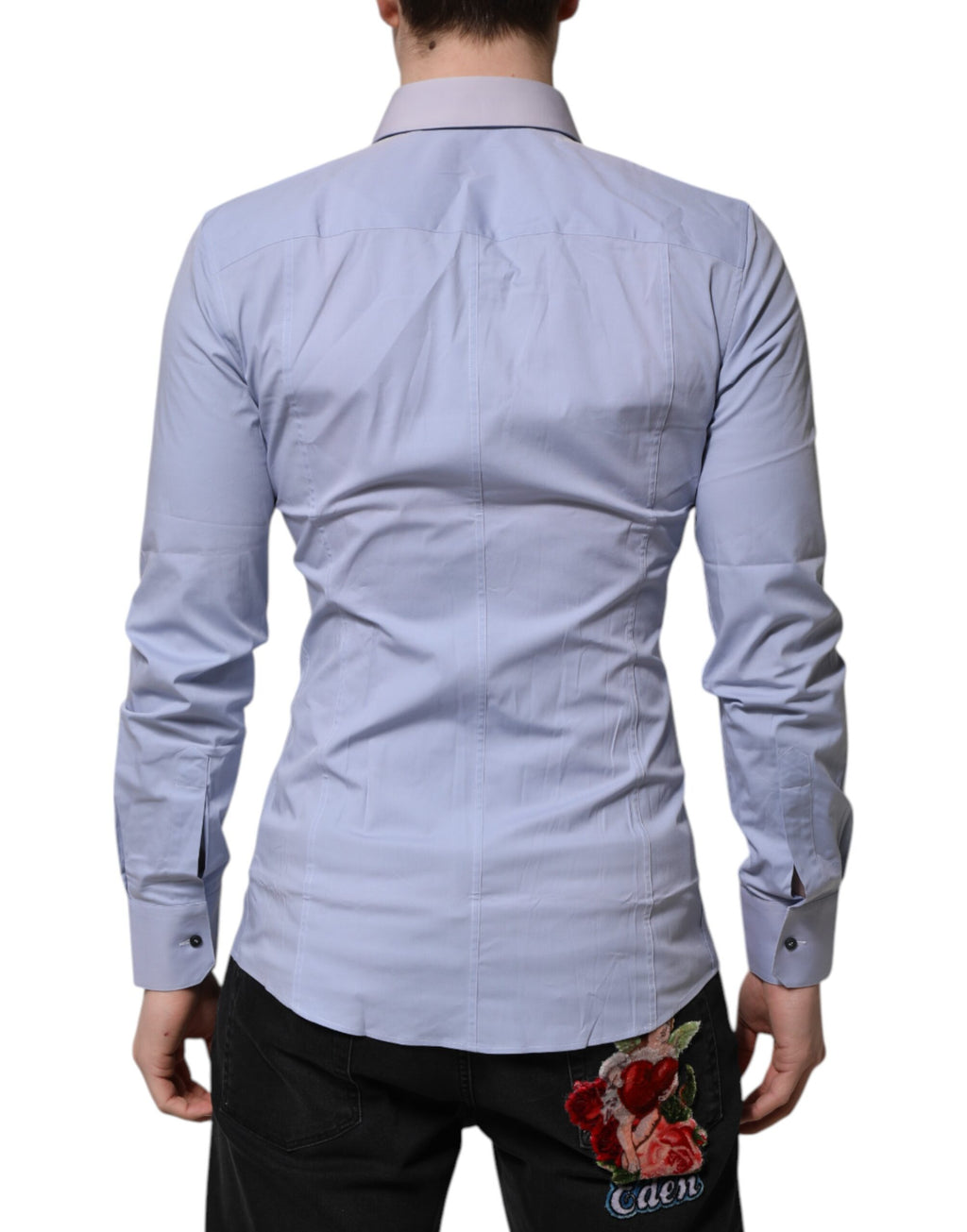 Chemise longue à manches longues Dolce & Gabbana en coton bleu Sicilia, élégante et sophistiquée, visible en détail.