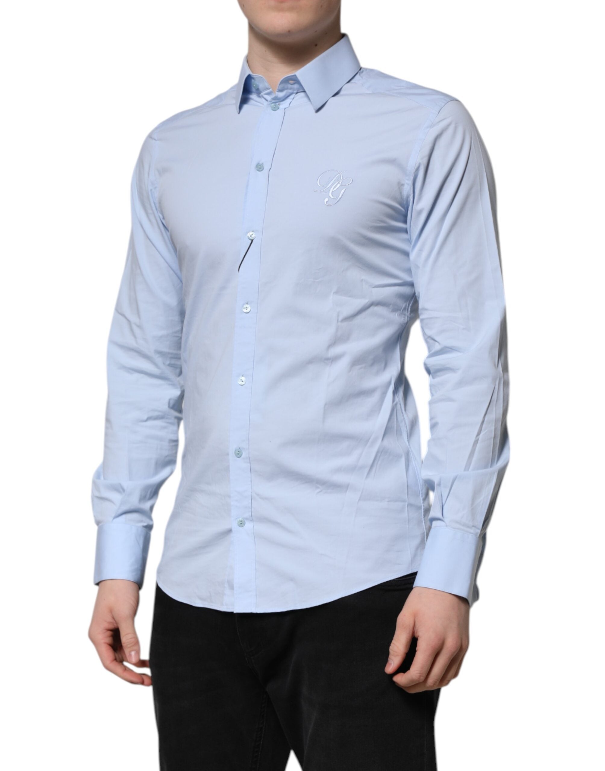 Chemise longue en coton bleu ciel Dolce & Gabbana avec manches longues et détails dorés, élégante et sophistiquée.