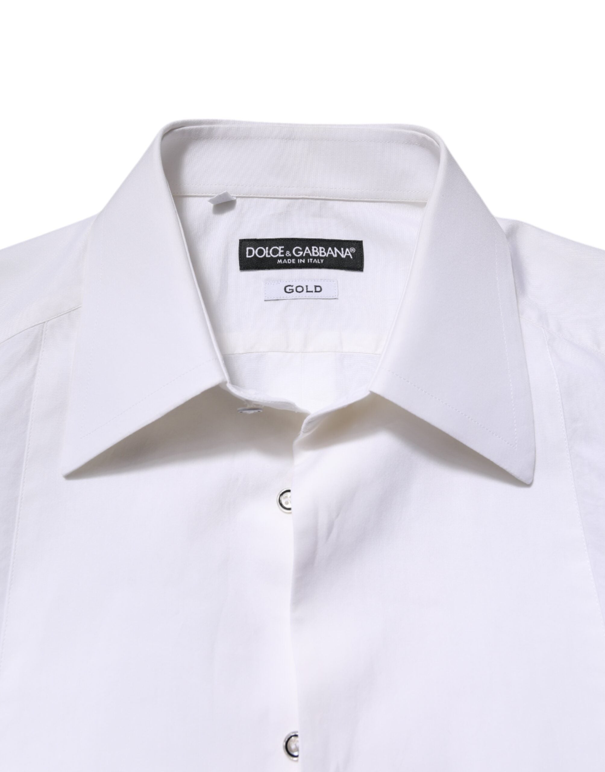 Chemise blanche en coton à manches longues de Dolce & Gabbana, élégante et sophistiquée, avec détails dorés visible sur l'image.