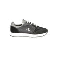 Sneakers noires en polyuréthane pour homme de la marque Calvin Klein, vue de face avec détails de design moderne.