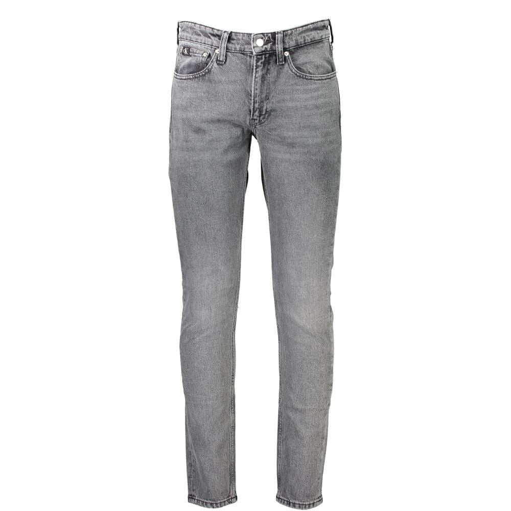 Jean homme en coton gris de la marque Calvin Klein, coupe classique avec détails de couture visibles.