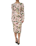 Robe midi rose en viscose Dolce & Gabbana avec coupe ajustée et style élégant, mettant en valeur le tissu fluide et la silhouette.