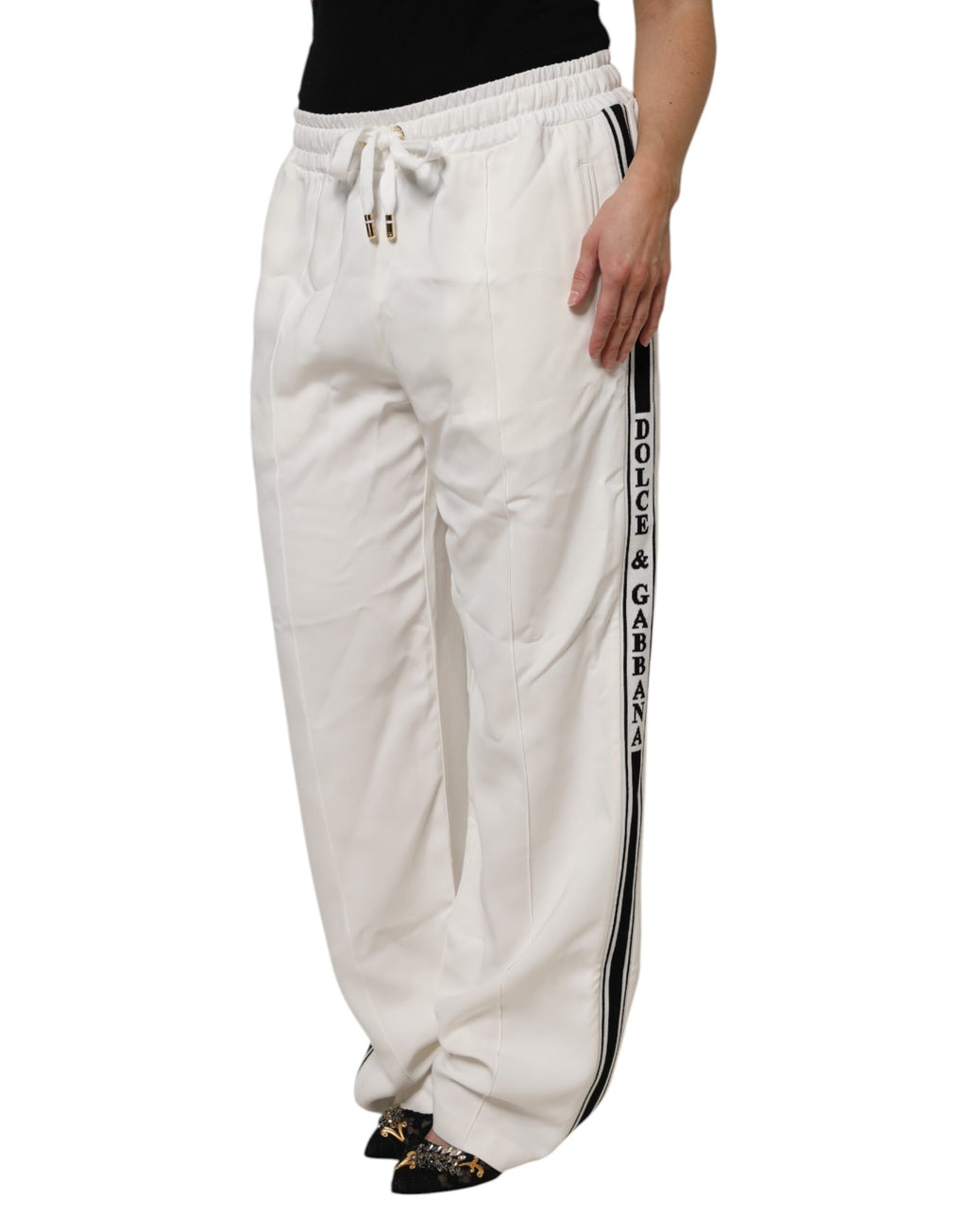 Pantalon de jogging blanc Dolce & Gabbana pour homme, style décontracté avec taille élastique et poches latérales.