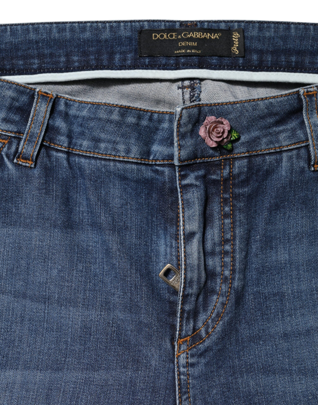 Jeans skinny en coton bleu à taille basse Dolce & Gabbana, coupe ajustée et style moderne, visibles sur l'image.