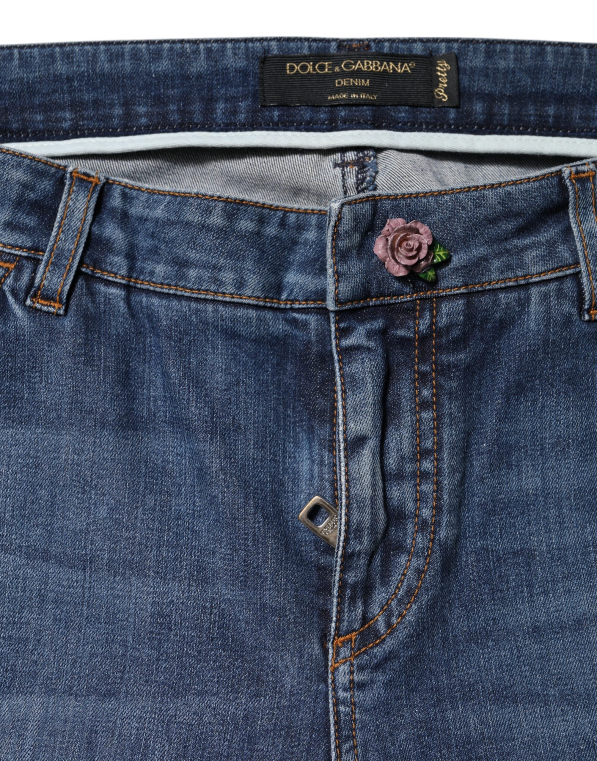 Jeans skinny en coton bleu à taille basse Dolce & Gabbana, coupe ajustée et style moderne, visibles sur l'image.