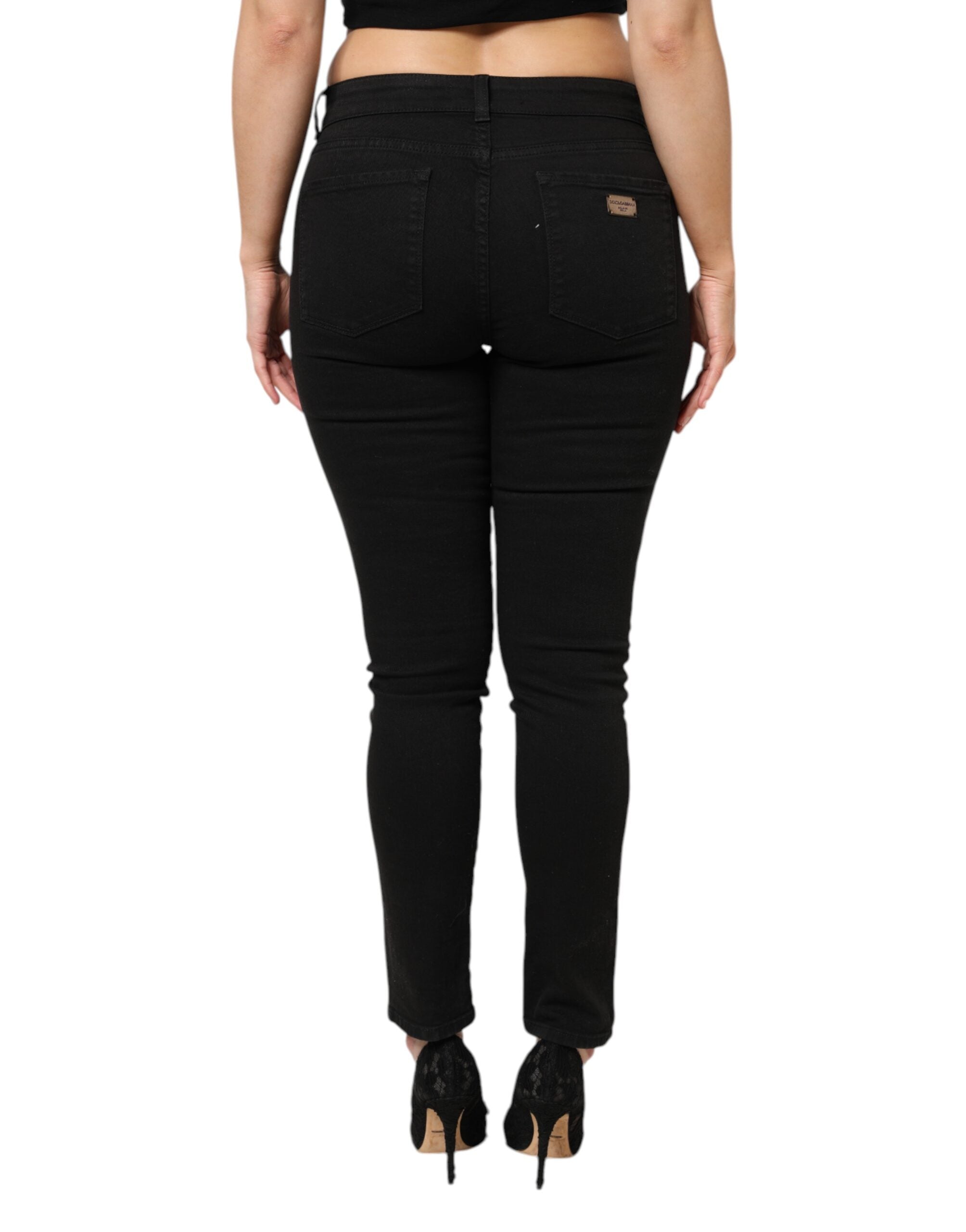 Jeans en denim noir Dolce & Gabbana à taille moyenne, coupe classique et détails en coton, pour un style élégant et décontracté.