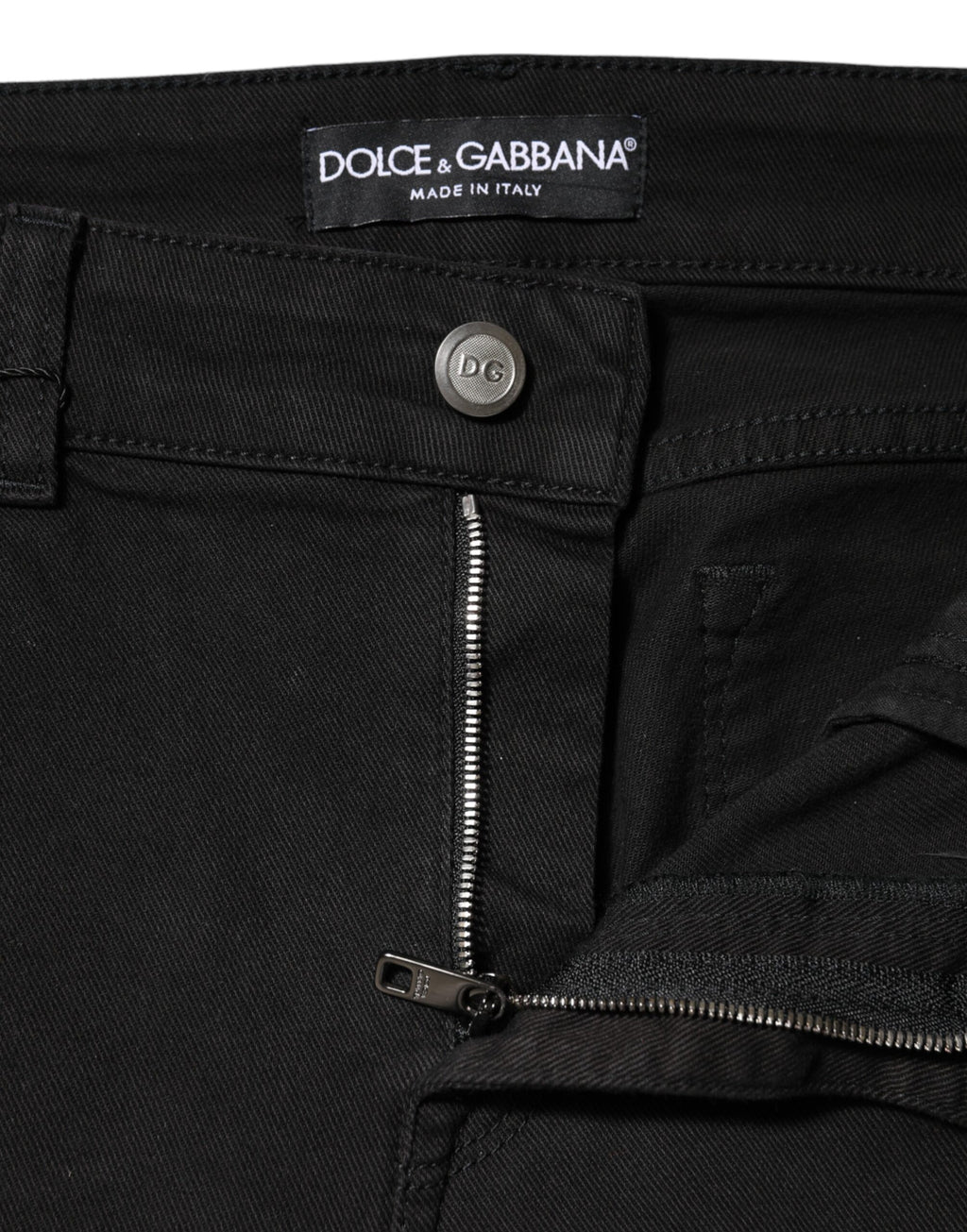 Jeans en denim noir Dolce & Gabbana, taille moyenne, coupe classique, visible en détail sur le produit.
