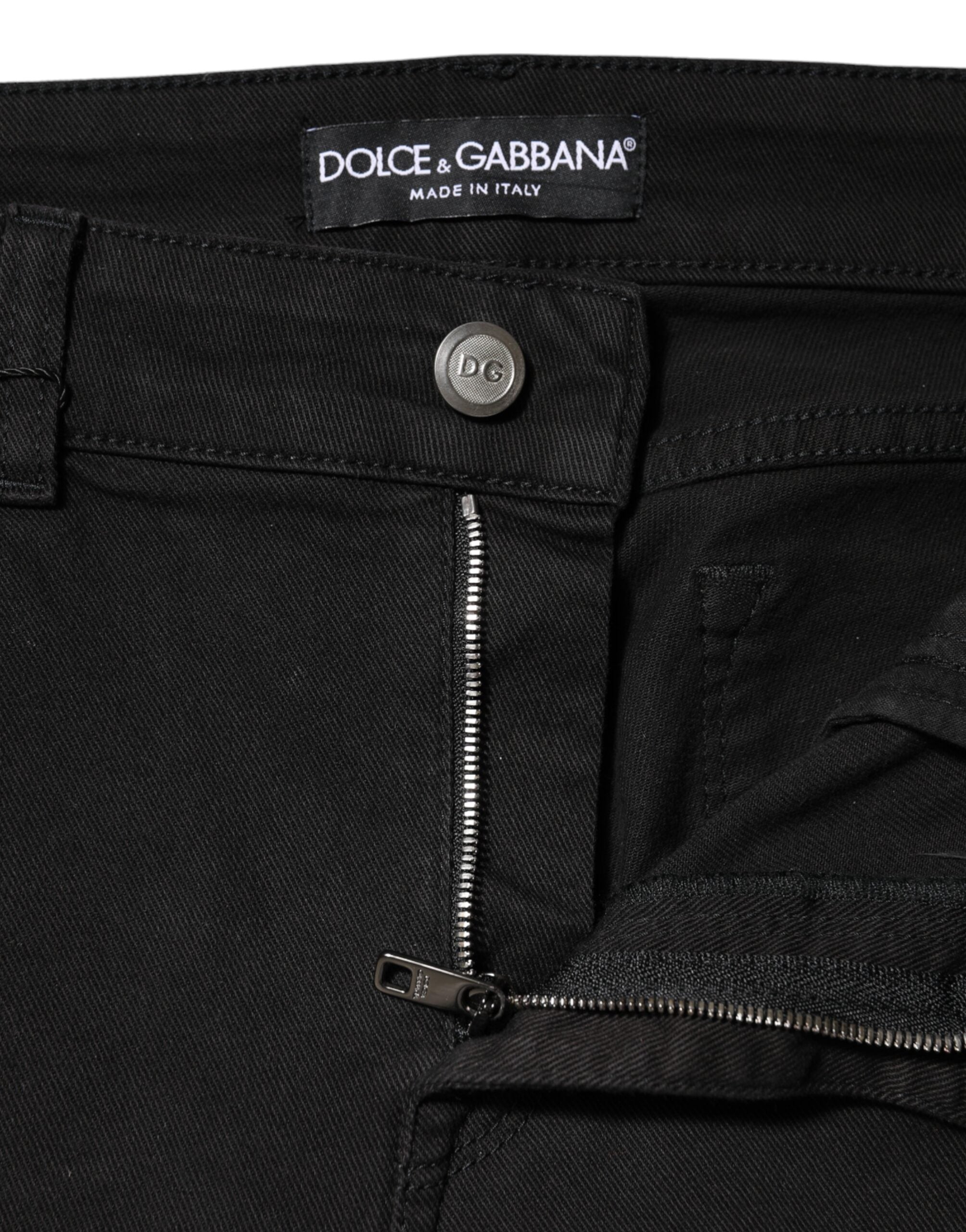 Jeans en denim noir Dolce & Gabbana, taille moyenne, coupe classique, visible en détail sur le produit.