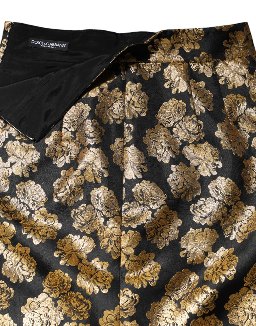 Jupe courte en jacquard noir à motif floral doré de Dolce & Gabbana, élégante et sophistiquée.