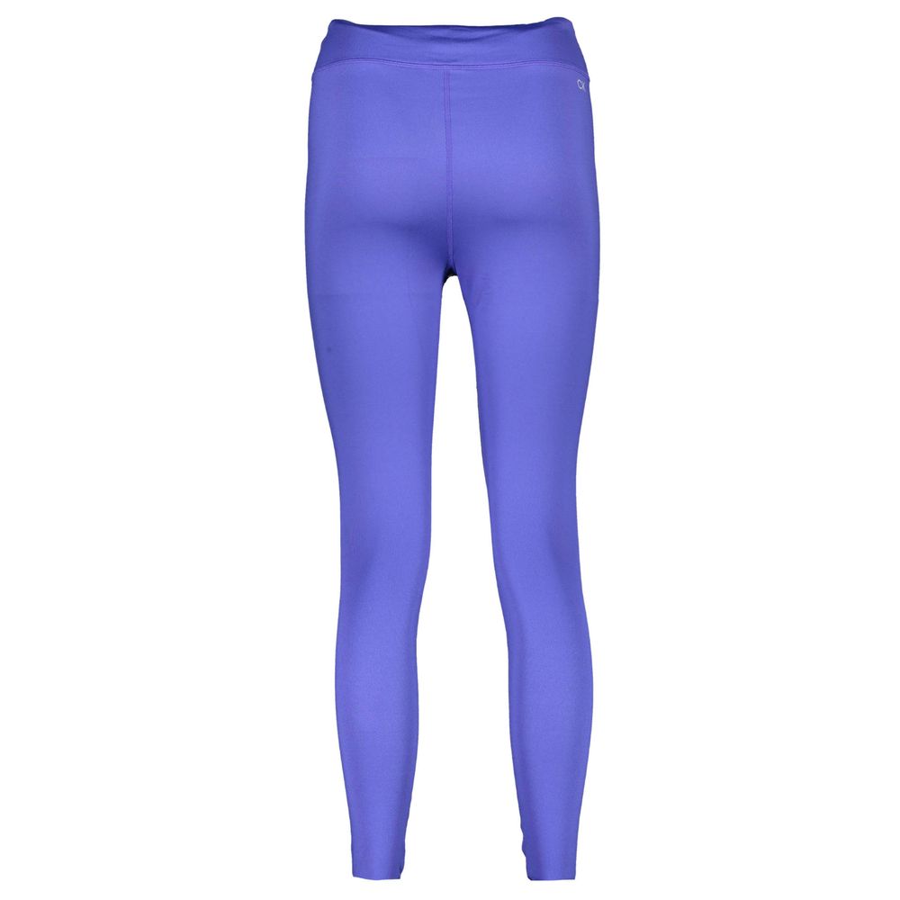 Leggings pour femme Calvin Klein Blu en polyester, ajustés, avec logo discret, portés par une femme dans une tenue décontractée.
