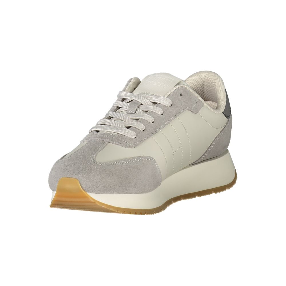Sneakers pour hommes Tommy Hilfiger gris en polyuréthane, style décontracté, avec semelle blanche et design moderne.