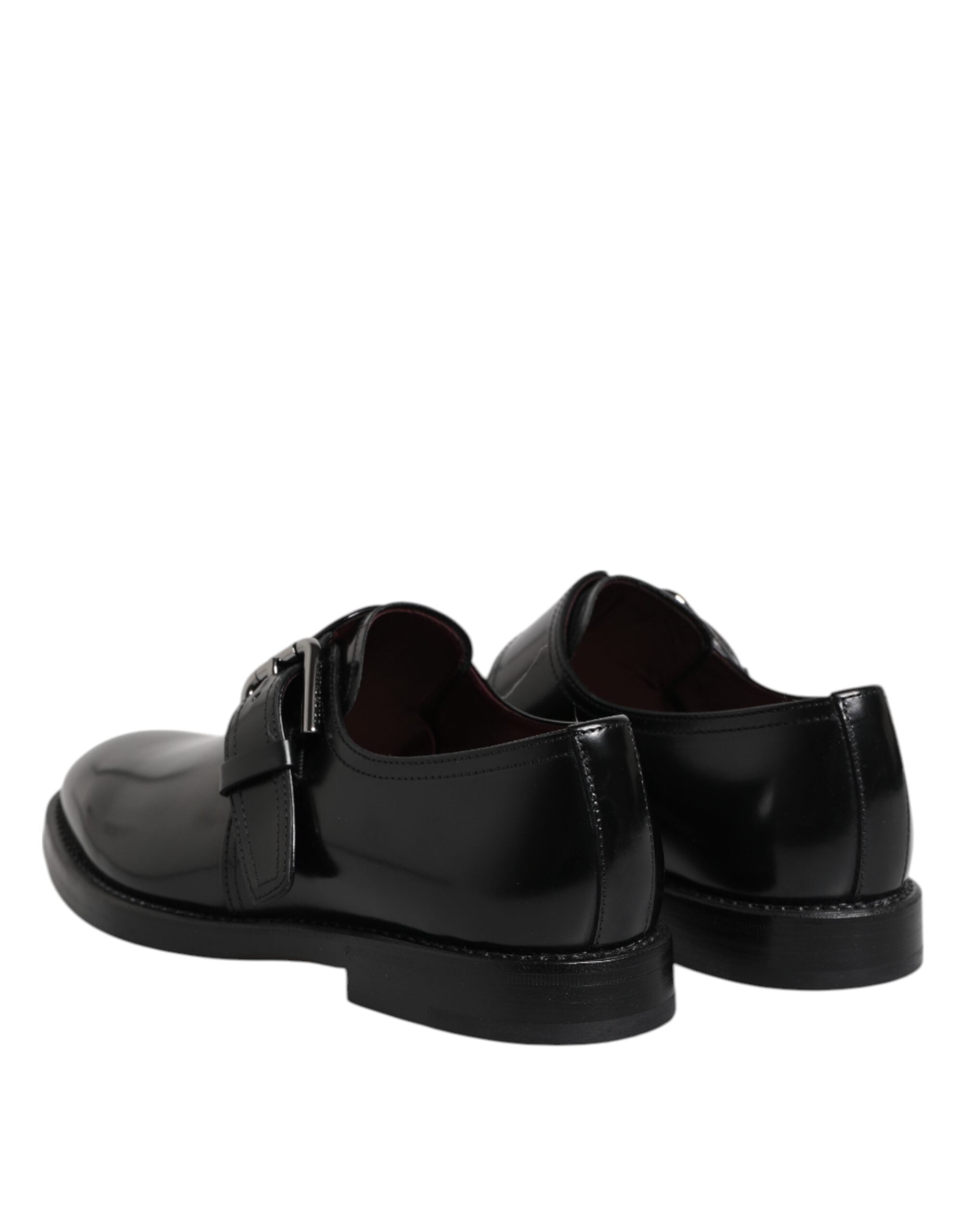 Chaussures formelles Derby en cuir noir Dolce & Gabbana avec boucle monk strap, élégantes et sophistiquées.