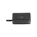 Sac à main pour femme Calvin Klein en polyester noir, élégant et pratique, avec poignées et détails modernes.