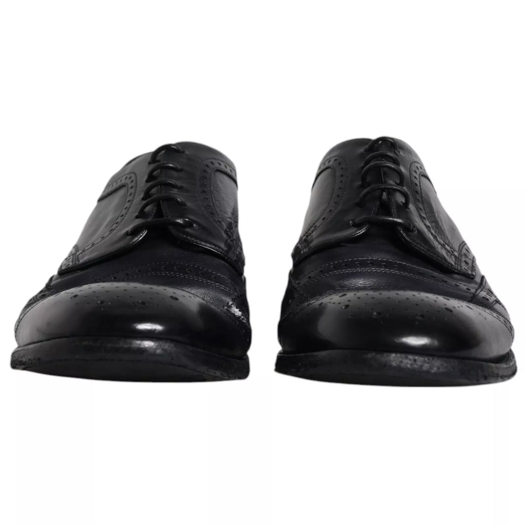Chaussures derby en cuir bleu foncé de Dolce & Gabbana, chaussures formelles wingtip pour homme, détails élégants en cuir.