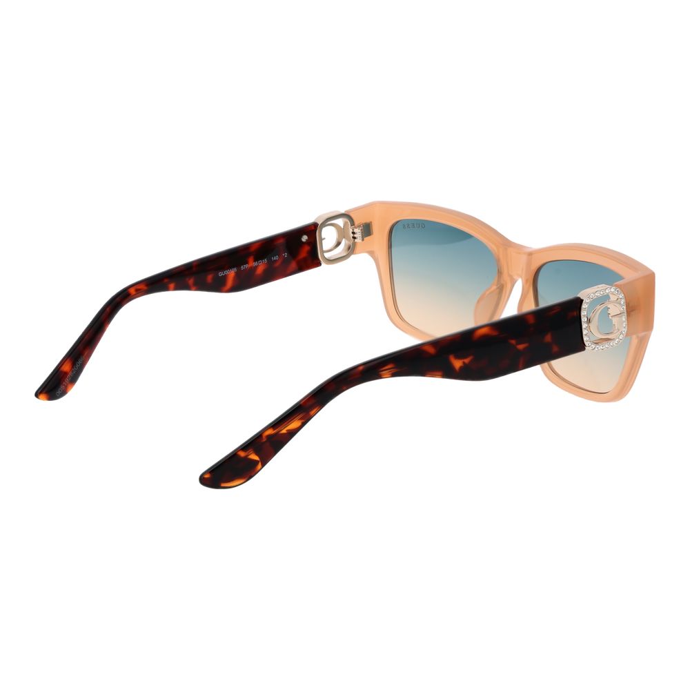 Lunettes de soleil Guess en acier inoxydable beige avec monture élégante et verres teintés, style moderne et sophistiqué.