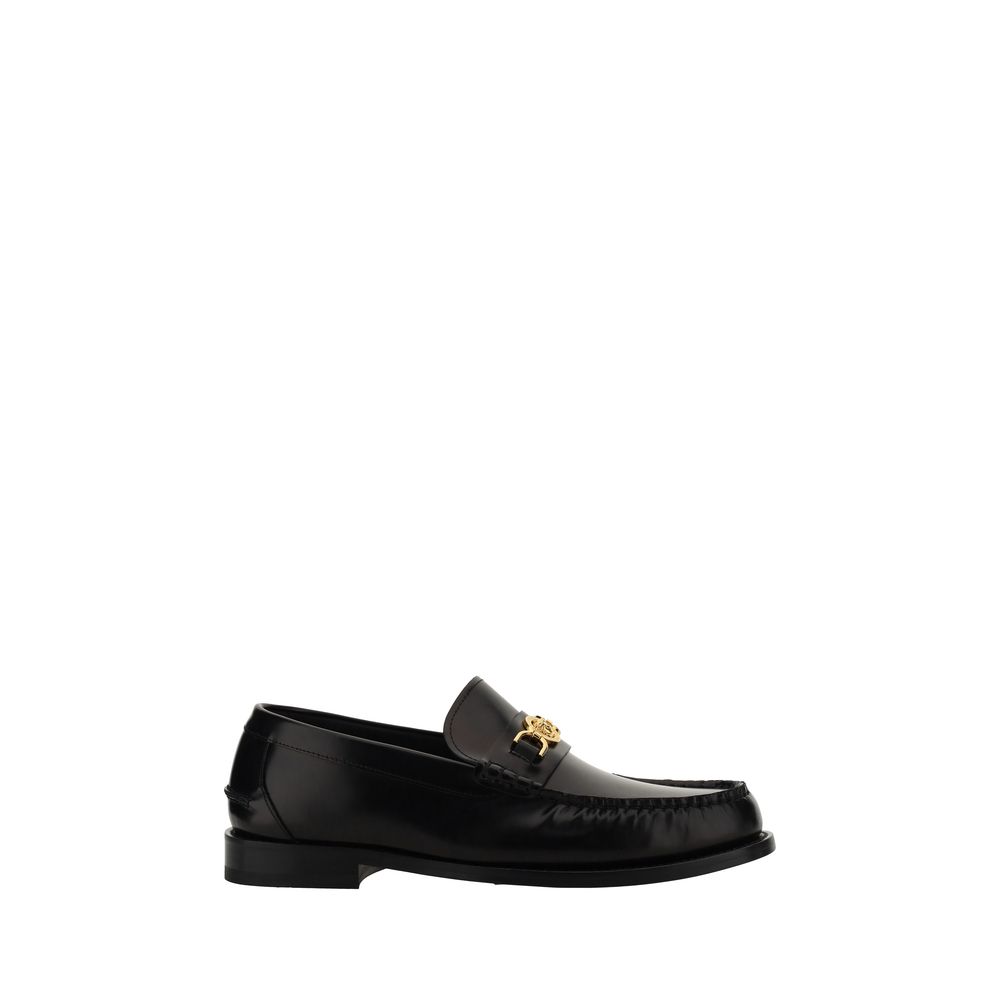 Chaussures mocassins Bos Taurus en cuir noir pour homme de Versace, élégantes et sophistiquées, vues en gros plan.