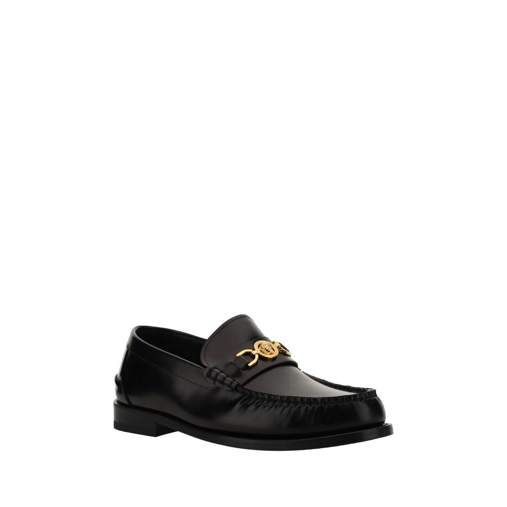 Mocassins noirs en cuir de veau Versace Bos Taurus à enfiler, élégants et sophistiqués pour homme.