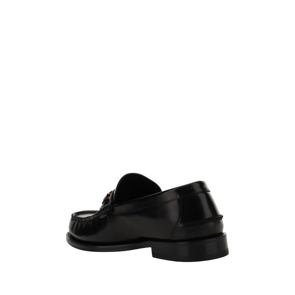 Chaussures loafers en cuir de veau noir Versace Bos Taurus, slip-on élégants et sophistiqués pour homme.