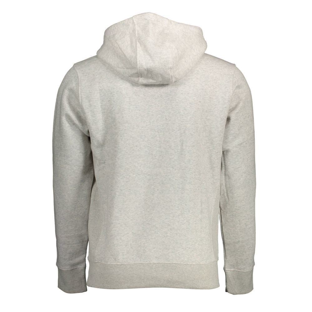 Pull gris en coton pour homme de Tommy Hilfiger, à col rond, porté par un mannequin.