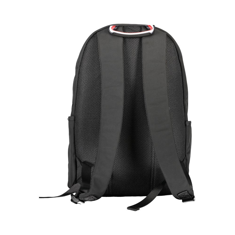 Sac à dos homme Tommy Hilfiger en polyester noir, avec compartiments et logo distinctif visible sur le devant.