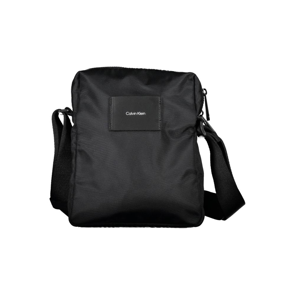 Sacoche pour homme Calvin Klein en polyester noir, sac d'épaule élégant avec logo Calvin Klein visible.