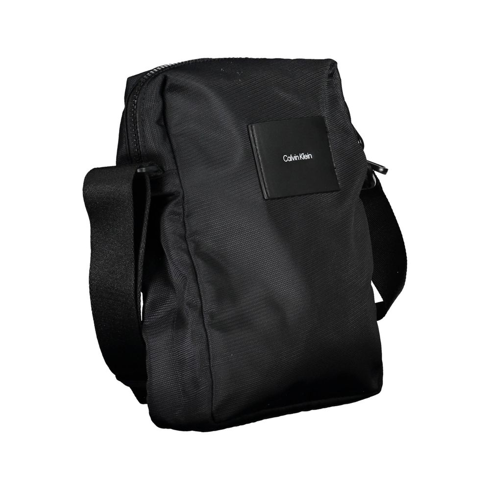 Sac à bandoulière pour homme de Calvin Klein en polyester noir, avec compartiments et design élégant.