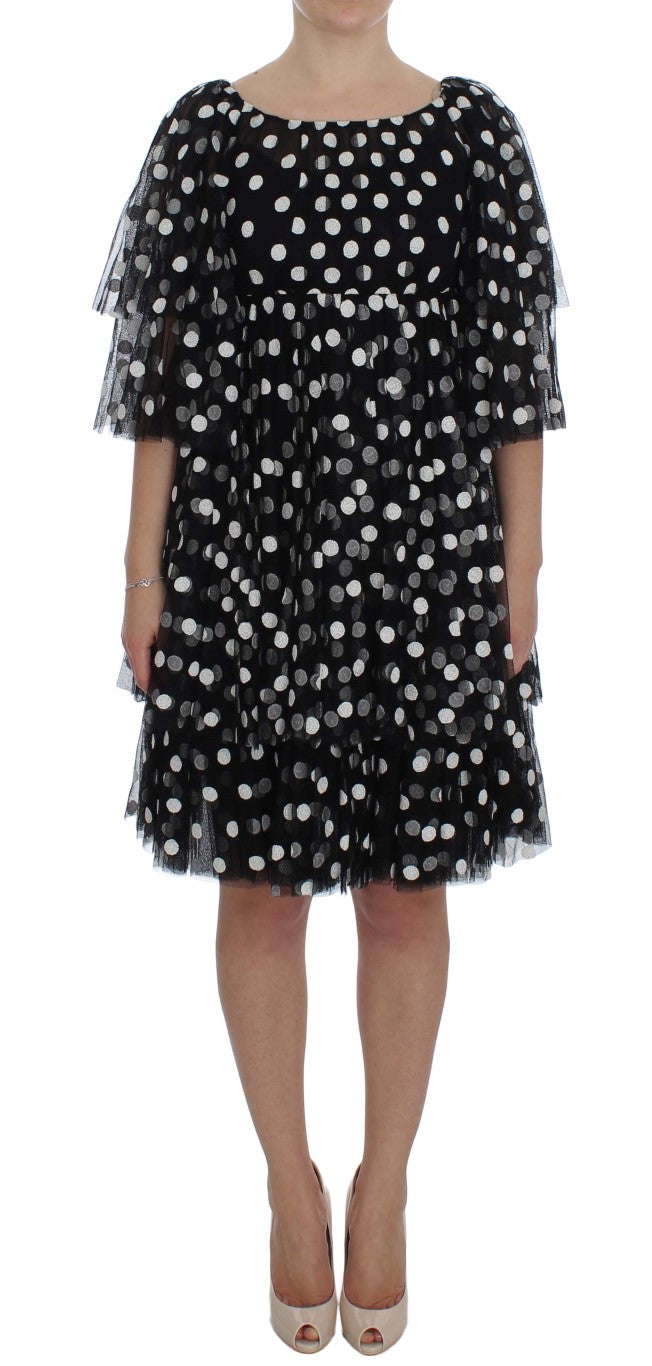 Robe noire et blanche à pois avec volants de Dolce & Gabbana, style élégant et féminin, en tissu léger.