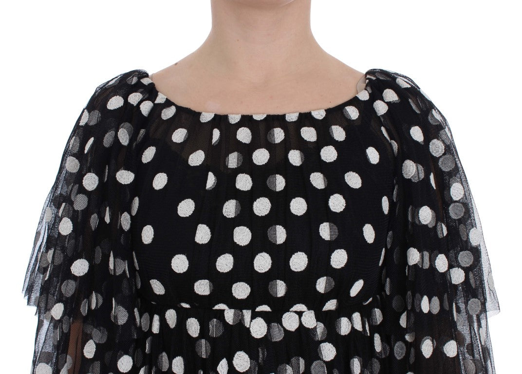Robe à pois noire et blanche Dolce & Gabbana avec volants, style élégant et féminin, en tissu léger.