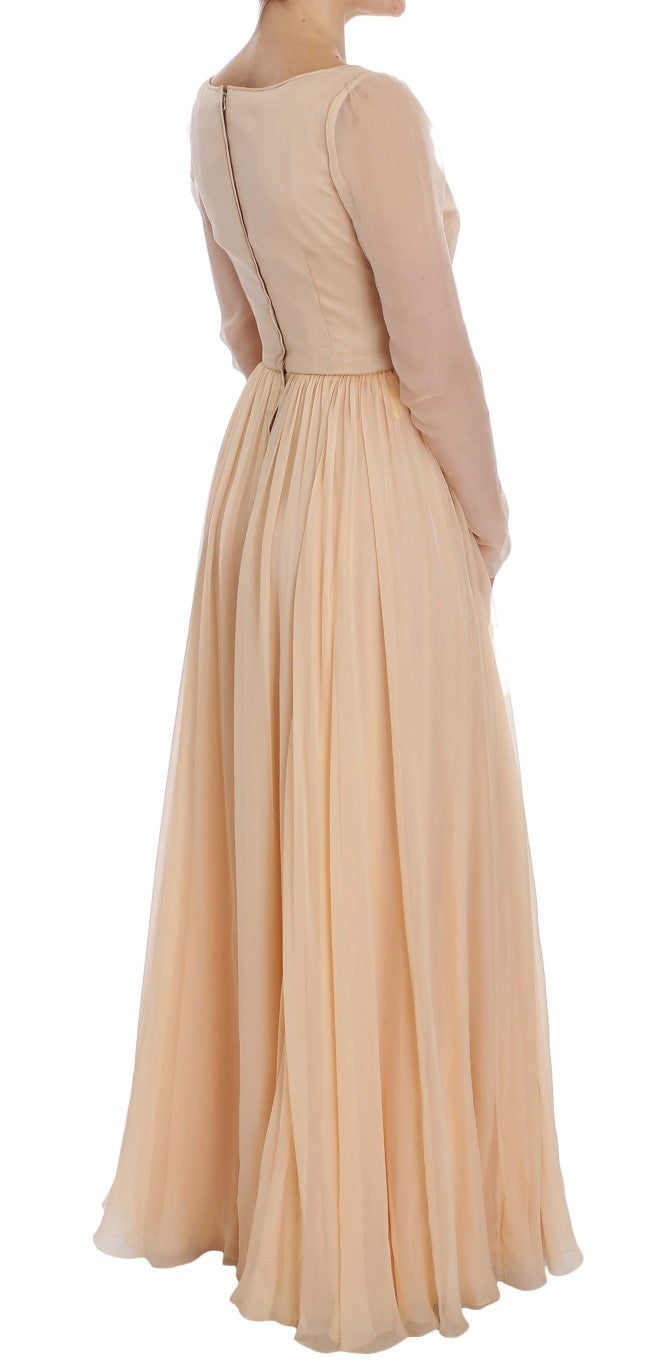 Robe de soirée en soie beige Dolce & Gabbana longue et élégante, vue de face, avec détails raffinés et coupe fluide.