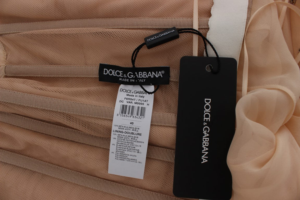 Robe de soirée en soie beige de Dolce & Gabbana, robe longue élégante avec détail de couture raffinée.