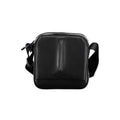Sac à bandoulière pour homme Calvin Klein en polyester noir, avec poches et détails modernes visible sur l'image.