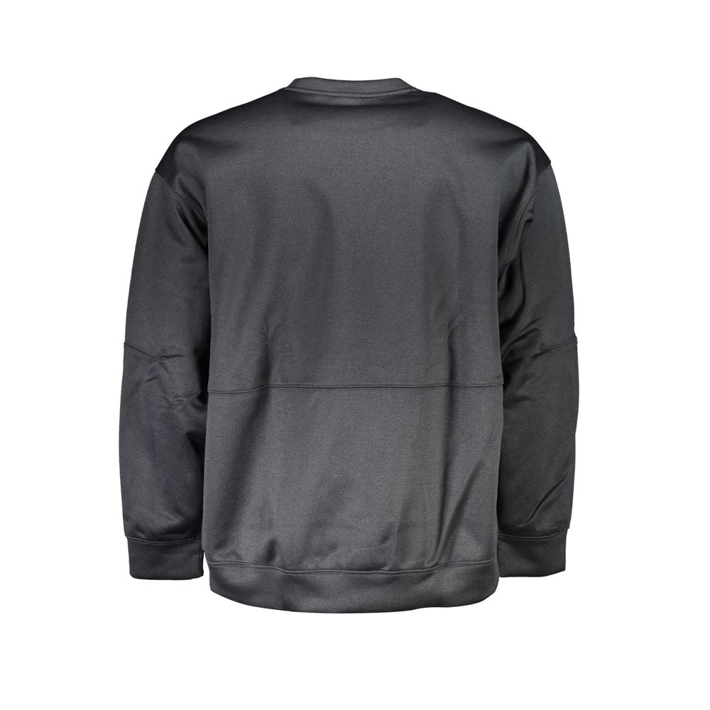 Pull homme Calvin Klein en polyester noir, pull-over élégant avec col rond et logo discret, porté sur un mannequin.
