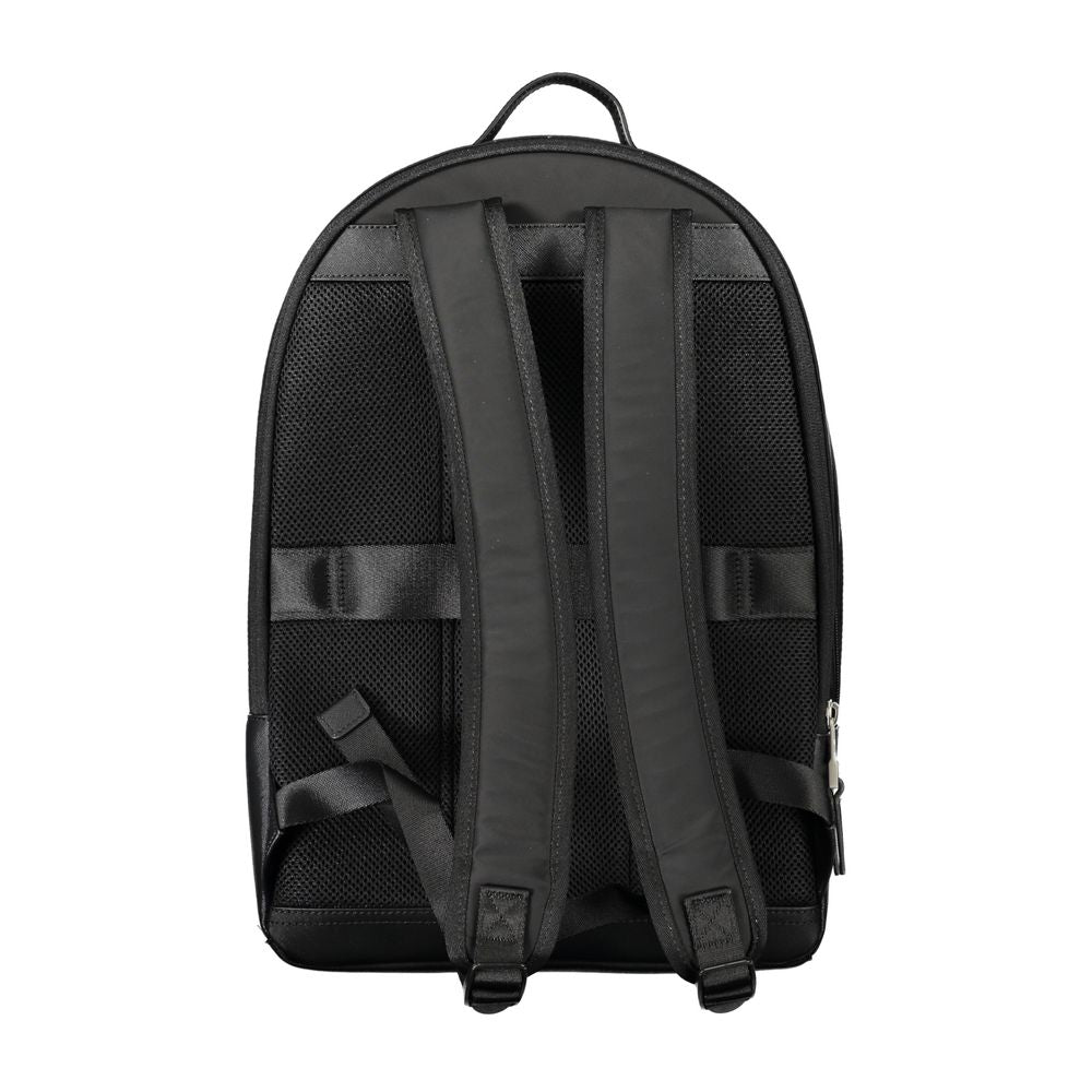 Sac à dos pour homme Tommy Hilfiger en polyester noir, avec compartiments et logo visible sur le devant.