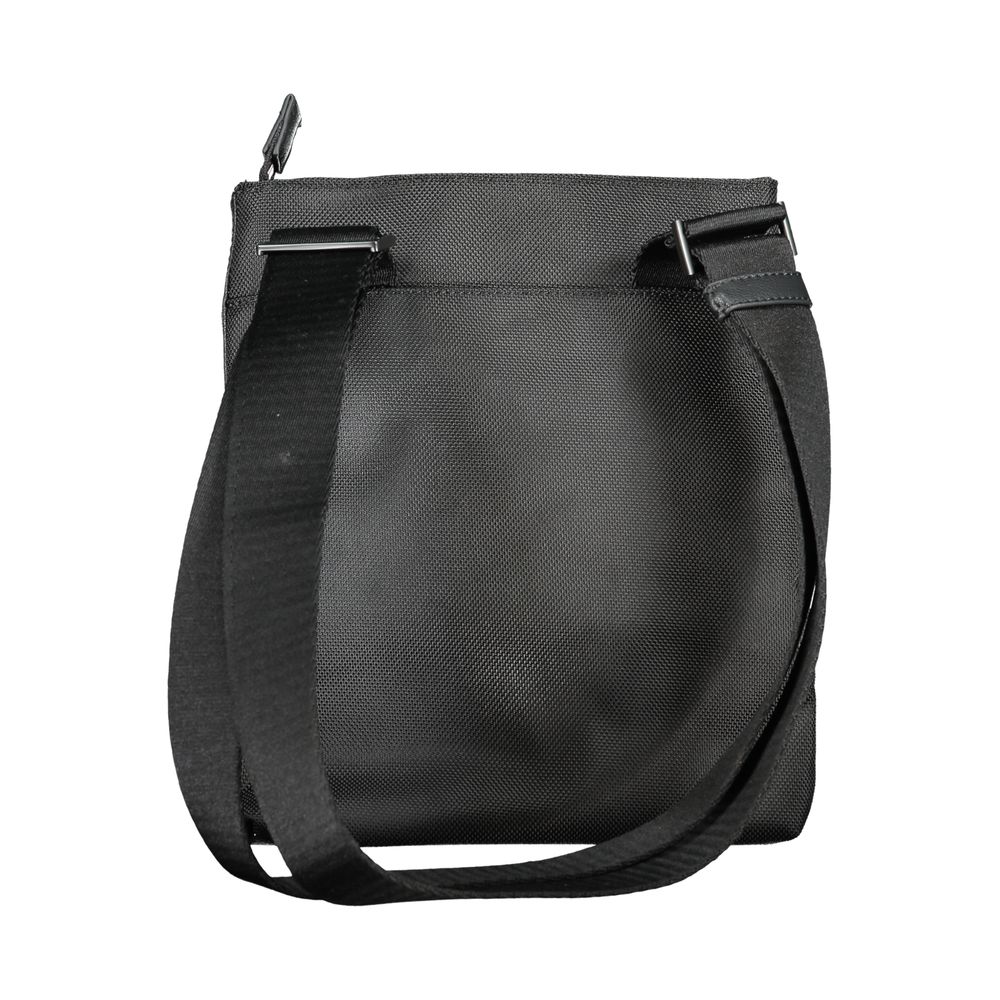 Sac à bandoulière pour homme Calvin Klein en polyester noir, avec poches et design épuré.