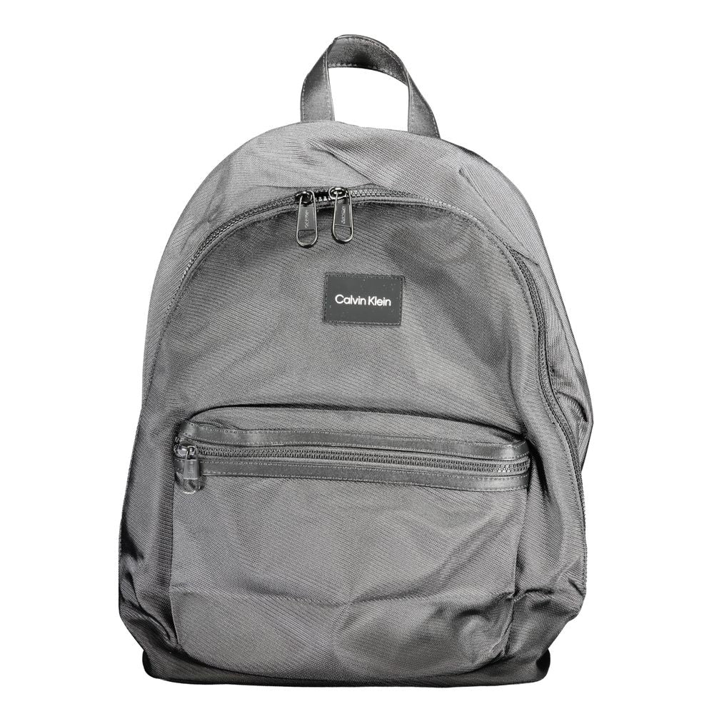 Sac à dos homme Calvin Klein en polyester noir, avec compartiments et design moderne.
