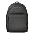 Sac à dos homme Tommy Hilfiger en polyester noir, avec poches zippées et logo emblématique visible sur le devant.
